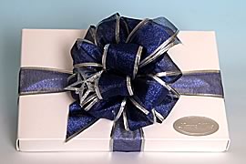 Box wrapped with ribbon and bells