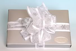 Box wrapped with snowflake paper.
